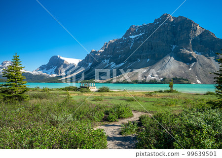 Banff National Park beautiful landscape. Bow Lake lakeshore trail and wooden bridge. Alberta, Canada. Canadian Rockies nature scenery. Banff National Park beautiful landscape. Bow Lake lakeshore trail and wooden bridge. Alberta, Canada. Canadian Rockies nature scenery. 99639501