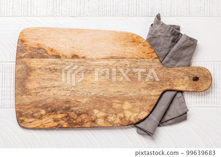 Wooden cutting board and kitchen towel 99639683
