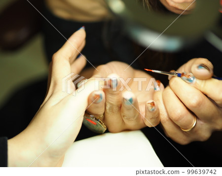woman applying nails woman applying nails 99639742