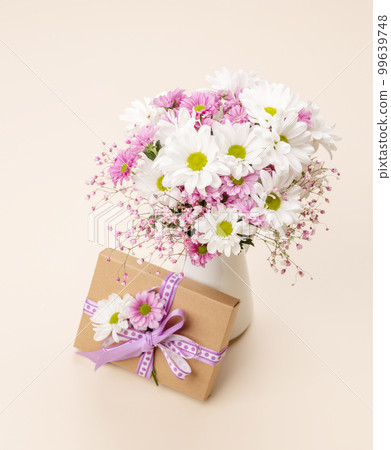 Gift box, Easter eggs and flowers 99639748