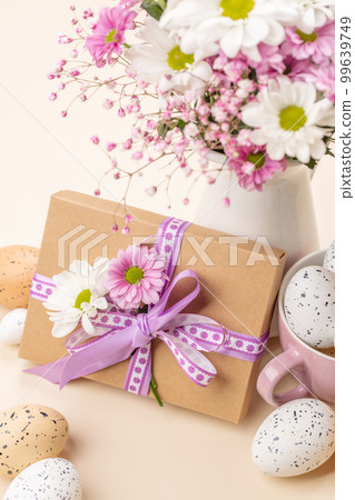 Gift box, Easter eggs and flowers 99639749