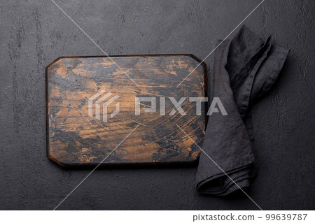 Wooden cutting board and kitchen towel Wooden cutting board and kitchen towel 99639787