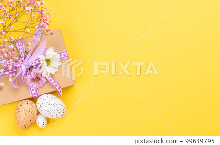 Gift box, Easter eggs and flowers 99639795