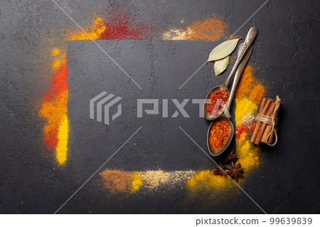 Various spices on stone table 99639839