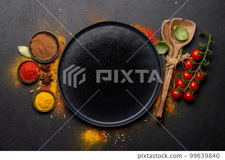 Empty plate and various spices 99639840