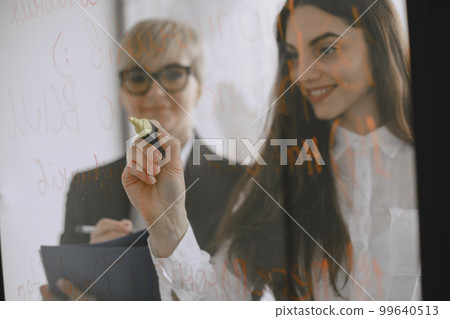 Manager working in the office. Lady in glasses. Women smiling. Manager working in the office. Lady in glasses. Women smiling. 99640513