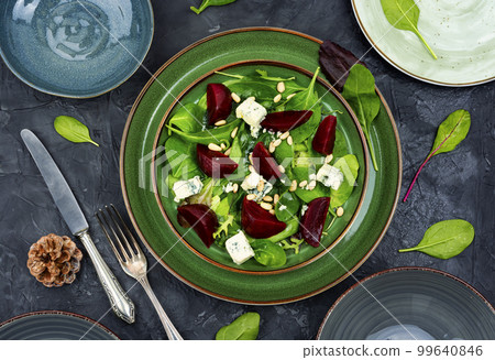 Fresh salad with beets, cheese and greens. 99640846