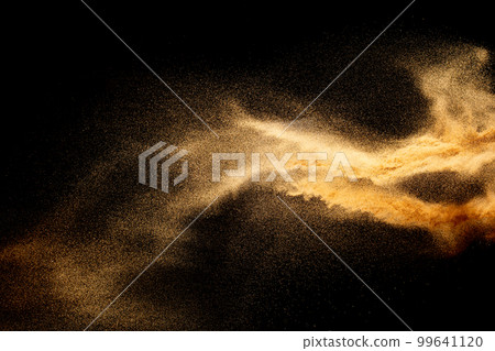 Sand explosion isolated on black background. Freeze motion of sandy dust splash.Sand texture concept. Sand explosion isolated on black background. Freeze motion of sandy dust splash.Sand texture concept. 99641120