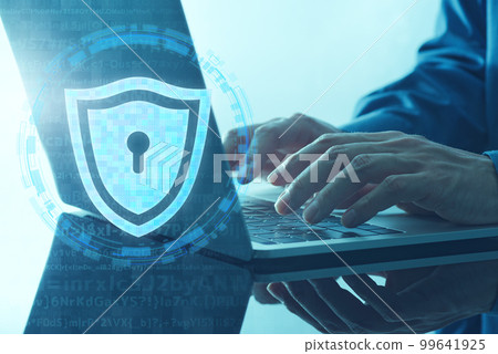 An image of a personal information protection system. Close up of hand using shield icon and laptop. 99641925