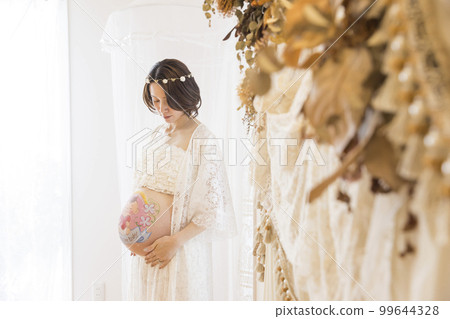 Pregnant woman with belly paint maternity paint 99644328