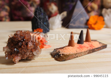 Aragonite Crystal With Incense and Stone Pyramid on Meditation Altar 99645115