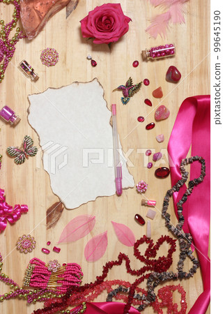 Pink and Magenta Jewelry With Rose and Blank Paper With Burned Edges 99645190