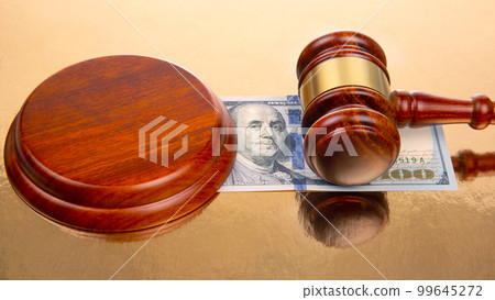gavel of justice on the background of dollars. corruption in law. buying a judgment gavel of justice on the background of dollars. corruption in law. buying a judgment 99645272