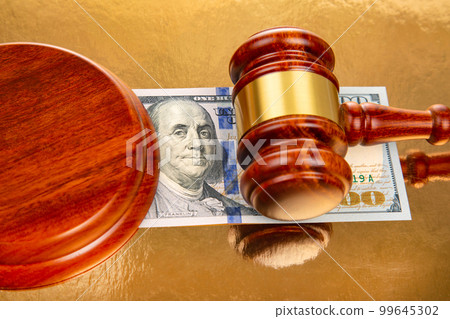 gavel of justice on the background of dollars. corruption in law. buying a judgment 99645302