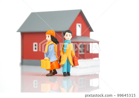 miniature people. romantic couple of young people near the house model 99645315