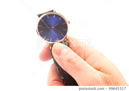Wristwatch in hand on a white background Wristwatch in hand on a white background 99645317