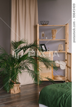 Wooden cabinet with shelves on which there is a decor in the living room Wooden cabinet with shelves on which there is a decor in the living room 99645409