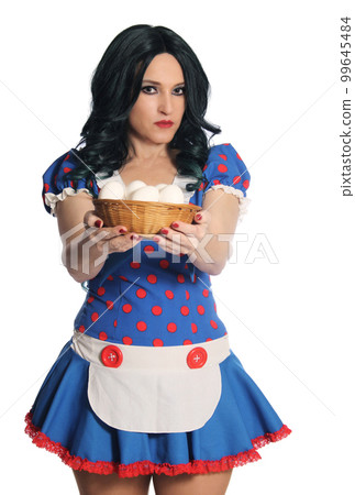 Woman in Retro Dress Holding Basket of Fresh Eggs 99645484