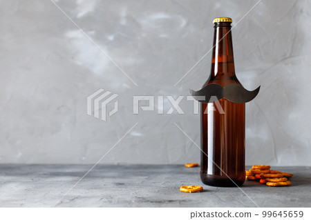 Bottle of beer with moustache. Movember. Concept of father's day, bachelor party. 99645659