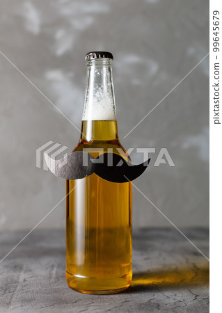 Bottle of beer with moustache. Movember. Concept of father's day, bachelor party. Bottle of beer with moustache. Movember. Concept of father's day, bachelor party. 99645679