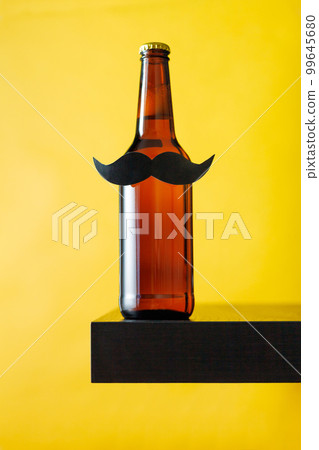 Bottle of beer with moustache. Movember. Concept of father's day, bachelor party. 99645680