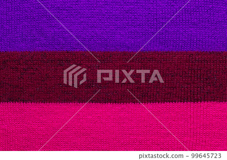 multi colored background. knitted wool fabric texture with stripes multi colored background. knitted wool fabric texture with stripes 99645723