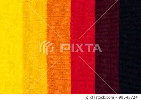 multi colored background. knitted wool fabric texture with stripes 99645724