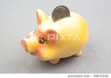 ceramic coin box in the shape of a pig. accumulation of finances and growth of monetary incomes 99645836