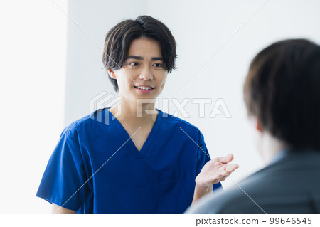 Man in scrub medical care 99646545