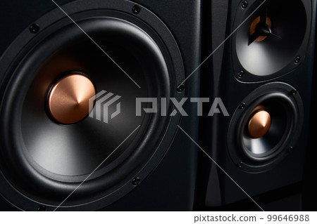Sound speaker on dark background, close up. Set for listening music. Audio equipment 99646988
