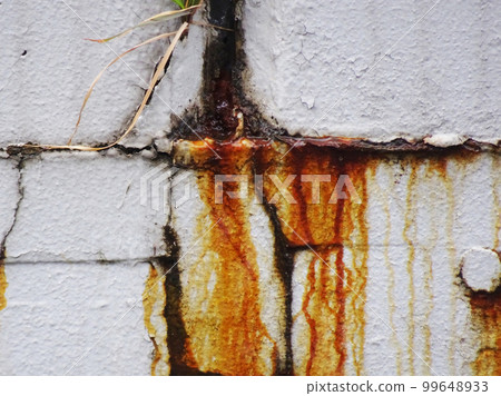 Reinforcing bars inside the concrete are rusted due to rainwater intrusion and rust juice is coming out. Reinforcing bars inside the concrete are rusted due to rainwater intrusion and rust juice is coming out. 99648933