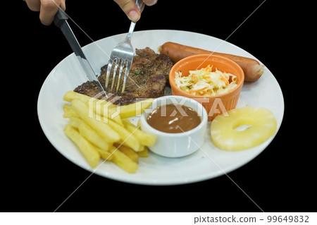 Top view of Steak with Kurobuta Pork Sausage coleslaw, french fried and pineapple, focus selective 99649832