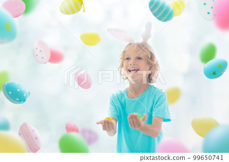 Kids on Easter egg hunt. Children dye eggs. Kids on Easter egg hunt. Children dye eggs. 99650741