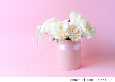 Bouquet white roses on pink background in a box. Mother's Day, Valentine's Day 99651298