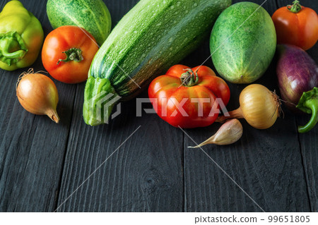 Set of fresh vegetables for a salad diet on a vintage table. Cooking salad in the restaurant kitchen. Free ad space Set of fresh vegetables for a salad diet on a vintage table. Cooking salad in the restaurant kitchen. Free ad space 99651805