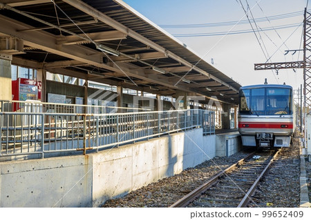 Nagoya City Meitetsu Series 5000 train stopping at Higashi-Nagoya Port Station 99652409