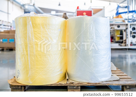 plastic rolls in the warehouse of the factory 99653512