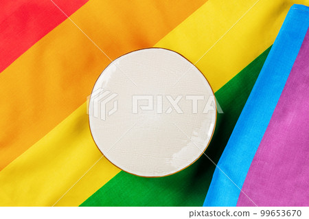 Gay food concept. A plate, overhead flat lay shot on the rainbow flag texture 99653670