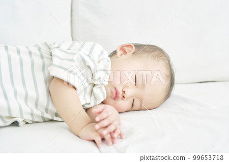 Infants taking a nap at home Infants taking a nap at home 99653718