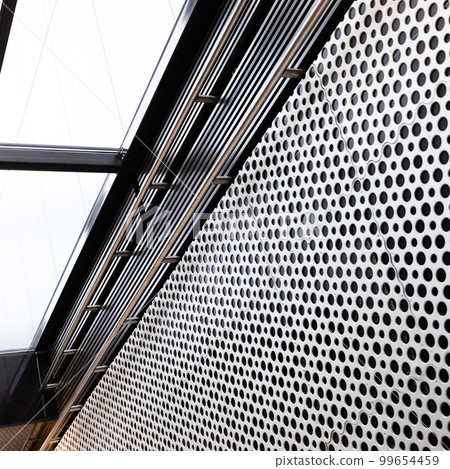 metal lattice wall and overhead light in underpass metal lattice wall and overhead light in underpass 99654459