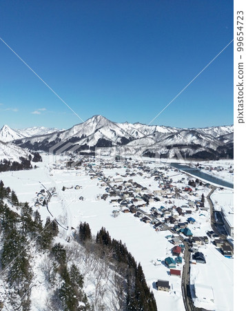 Oku-Aizu winter scenery Tadami River Tadami town district aerial view along Tadami line 99654723