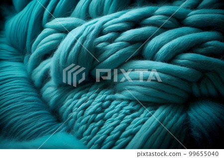 Bright turquoise woolen threads. Brains from yarn macro view knitting hobby needlework. Handmade natural rope skein warm clothes. Traditional knitting wool supplies Bright turquoise woolen threads. Brains from yarn macro view knitting hobby needlework. Handmade natural rope skein warm clothes. Traditional knitting wool supplies 99655040