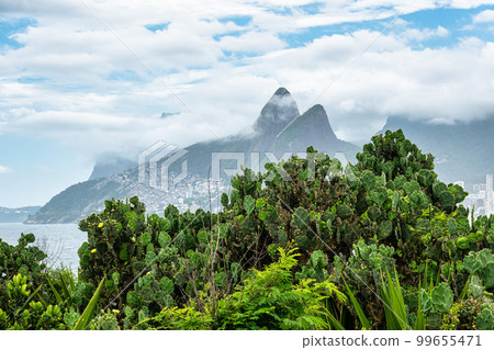 Arpoador Beach, Devil's Beach, Ipanema district of Rio de Janeiro Brazil. Dos Hermanos mountains in background. 99655471