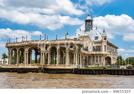Boat tour on the Parana Delta, Tigre, Buenos Aires, Argentina. Palm trees, construction site of modern brick house. 99655507