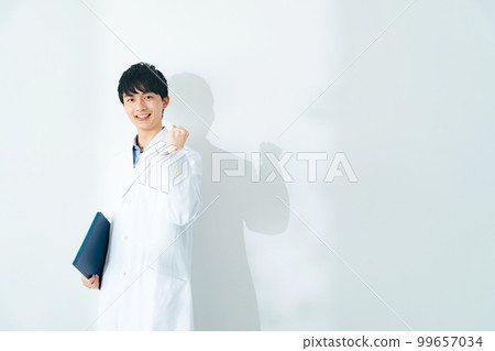 A young man in a white coat doing a guts pose, a science student, a medical student A young man in a white coat doing a guts pose, a science student, a medical student 99657034