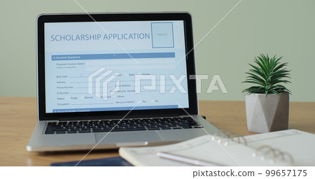Laptop computer with an Scholarship Application form on its display. Laptop computer with an Scholarship Application form on its display. 99657175