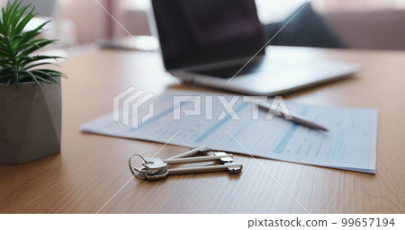 Mortgage Loan Application showing with laptop computer on a desk. Bank loan agreement or real estate rental contract. Write business agreement for entrepreneur. 99657194