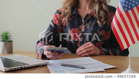 American woman consular officer giving passport to male immigrant, work visa, citizenship. Visa Application online form immigration concept. Visa approval. American woman consular officer giving passport to male immigrant, work visa, citizenship. Visa Application online form immigration concept. Visa approval. 99657294
