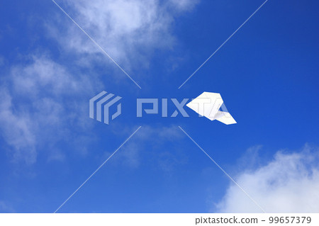 Paper plane flying in the sky 99657379