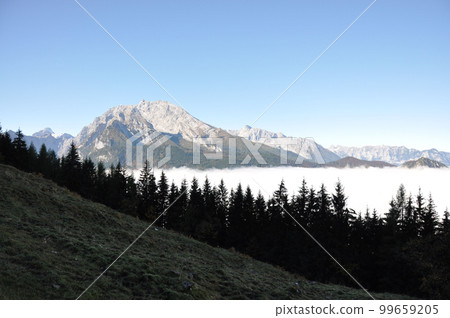 Mountains in Berchtesgadener Land, Alps in Bavaria, submerged in clouds Mountains in Berchtesgadener Land, Alps in Bavaria, submerged in clouds 99659205